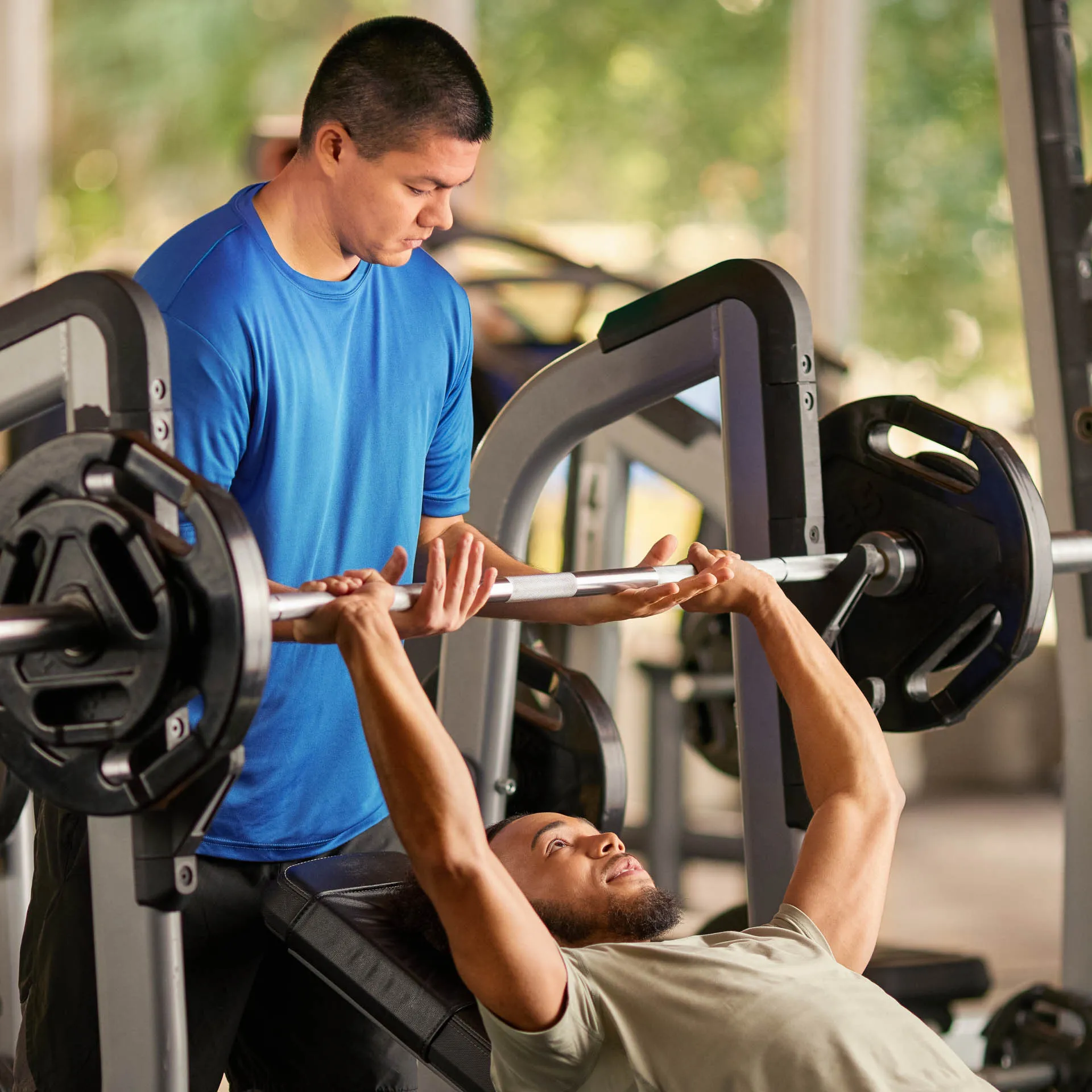 two men lifting weights