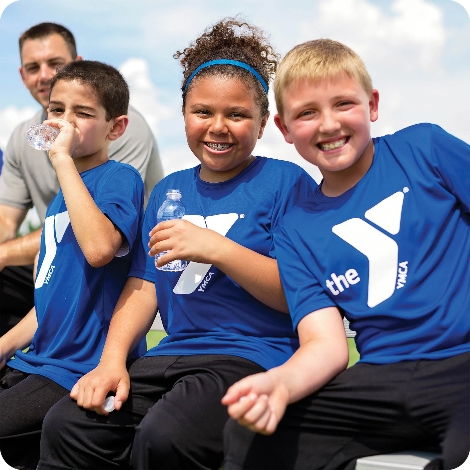 Three kids enjoying Y youth sports