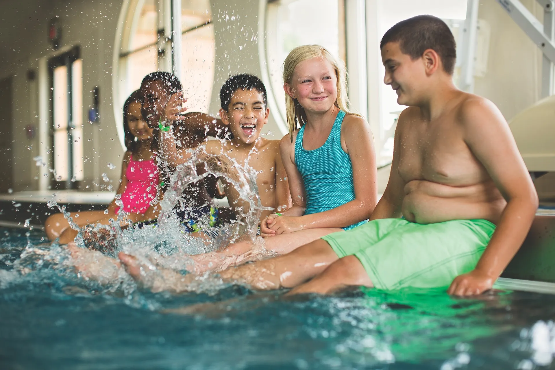 Kids splashing in pool