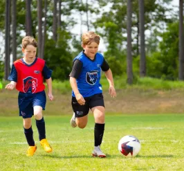 Two kids playing MLS GO Soccer