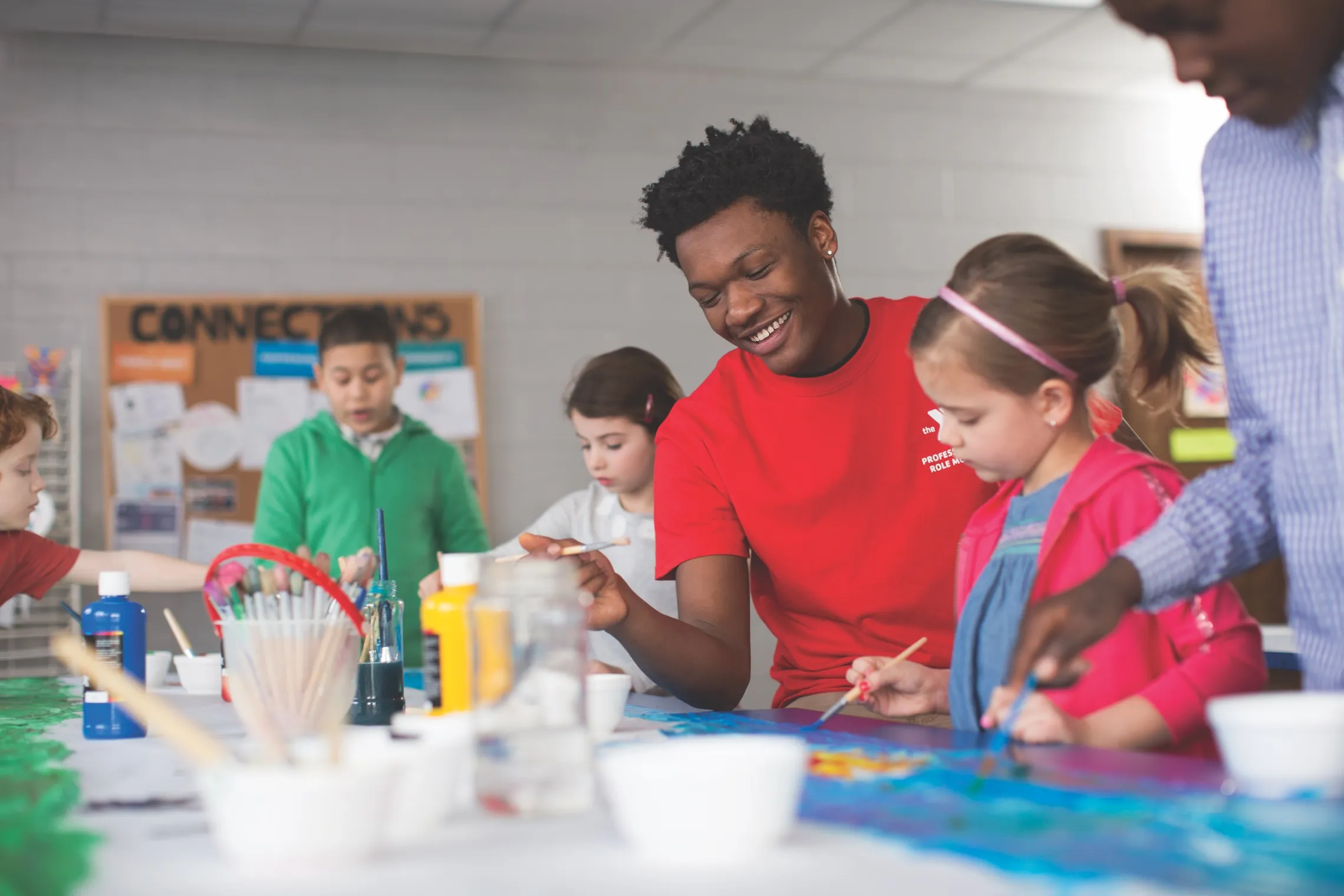 Kids and staff painting at Fundays
