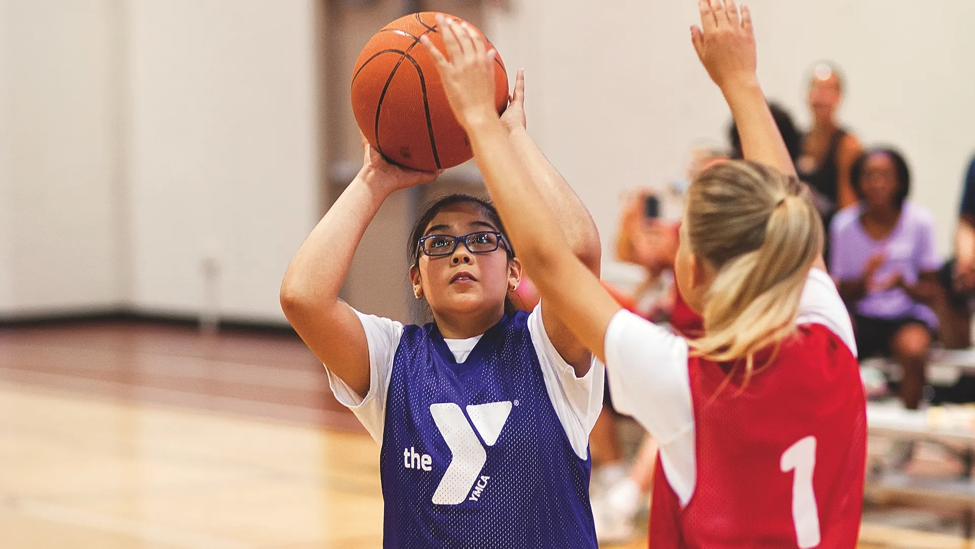 Girls playing youth basketball at the YMCA